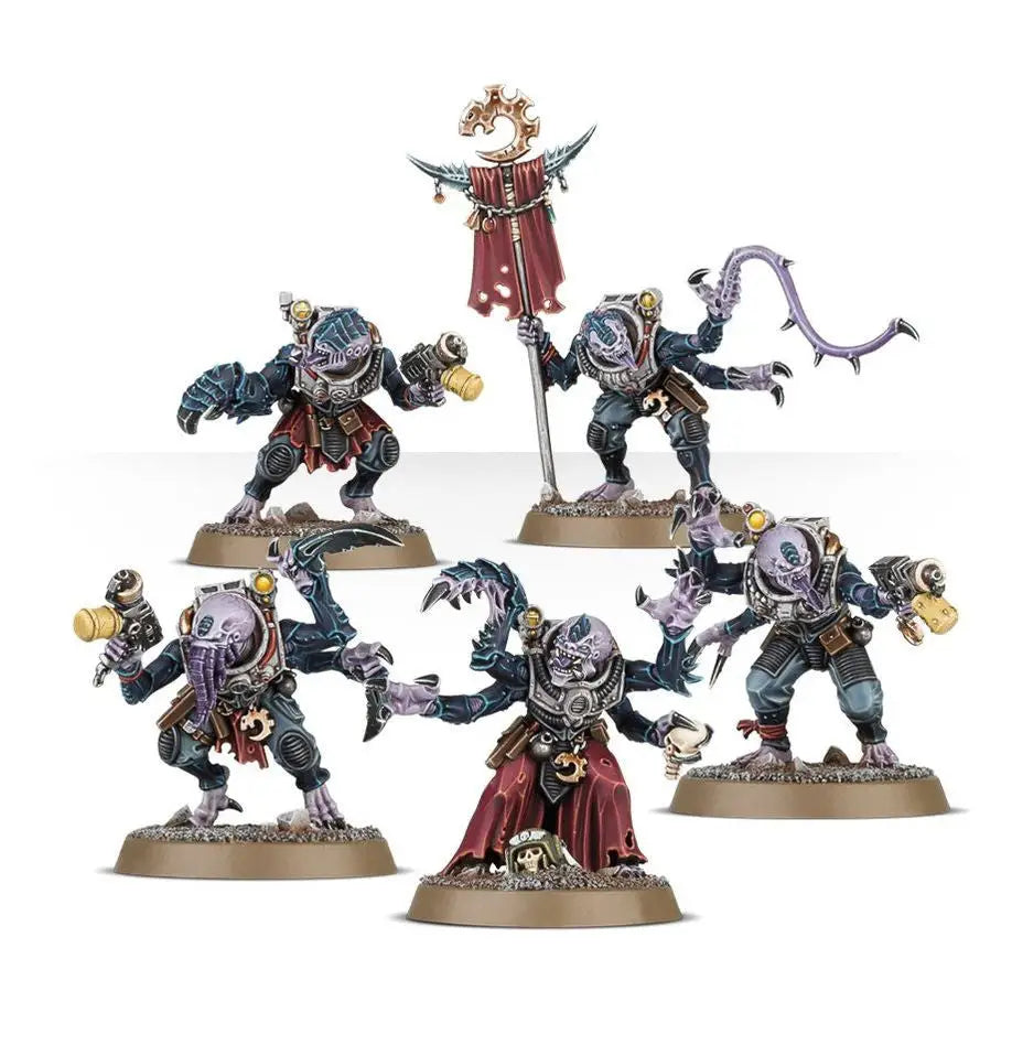 Miniature figures from Warhammer Combat Patrol Genestealer Cults featuring hybrid metamorphs and weapons