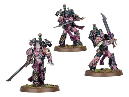 Three pink and black Warhammer 40K miniatures from Flawless Blades Emperor’s Children collection