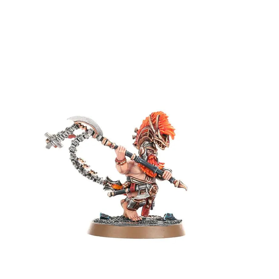 Painted miniature of a Hearthguard Berzerker with orange hair and curved weapon