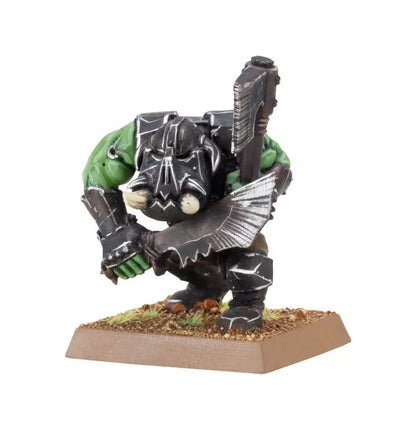 Miniature Orc Boyz figurine in battle stance with hand weapons from Goblin Tribes