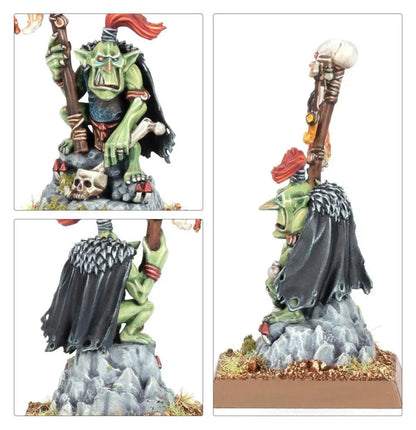 Green-skinned Goblin Shaman figurine wielding a skull-adorned staff on rocky base
