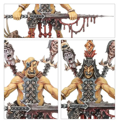 Miniature Orc figures with weapons and severed heads from Warhammer Orruk Warclans Hobgrot Slittaboss