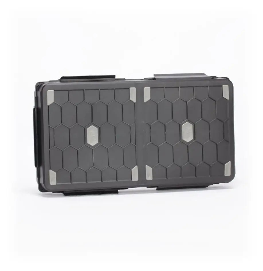 Black protective Stormvault Combat Case featuring hexagonal pattern and gray accents