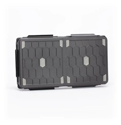 Black protective Stormvault Combat Case featuring hexagonal pattern and gray accents