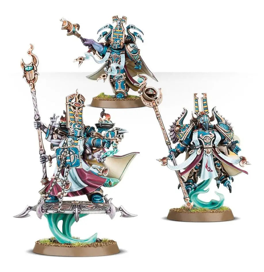 Three ornate blue and white miniature fantasy Exalted Sorcerers from Warhammer Thousand Sons