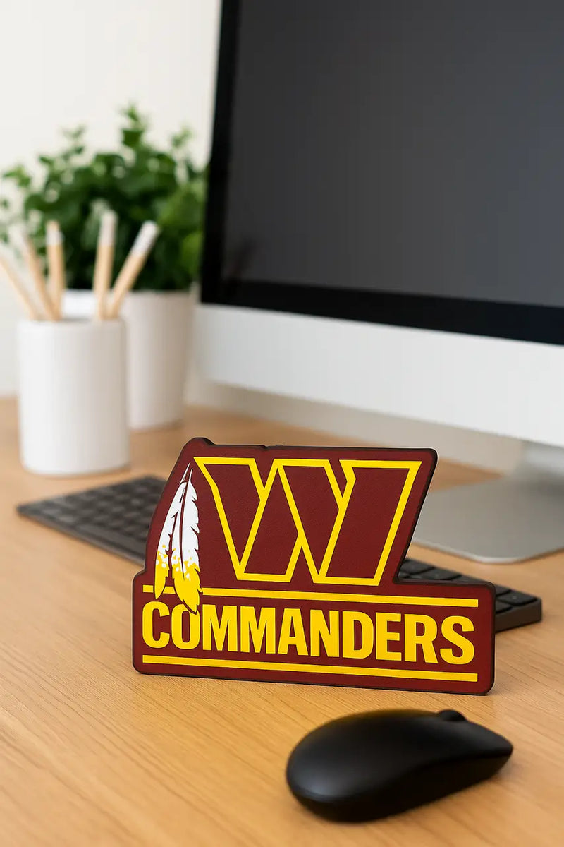 Maroon and gold Washington Commanders logo sign with feather graphic for NFL fan decor