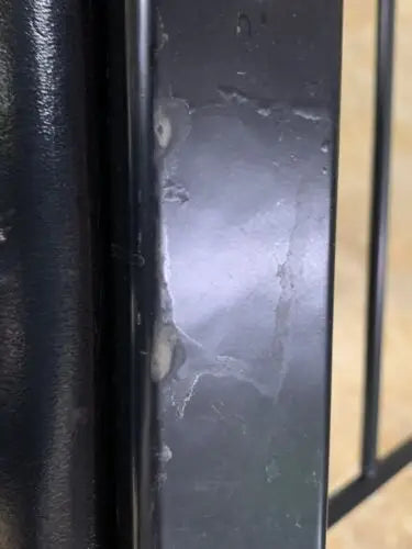 Damaged black metal railing next to WWE 2003 Vengeance Ringside VIP Chair at Pepsi Center