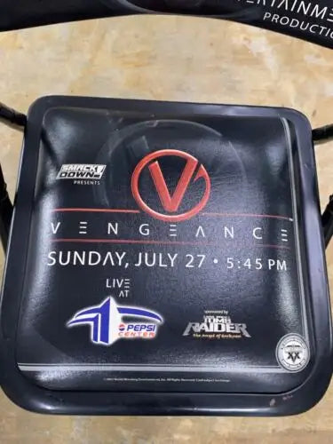 WWE Vengeance event advertisement featuring a ringside VIP chair from July 27, 2003